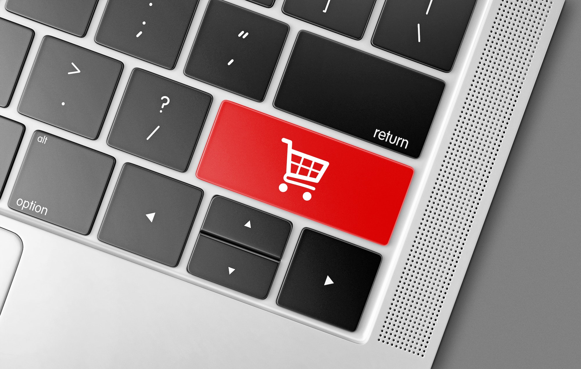 Red shopping cart key on a black computer keyboard, internet shopping concept picture