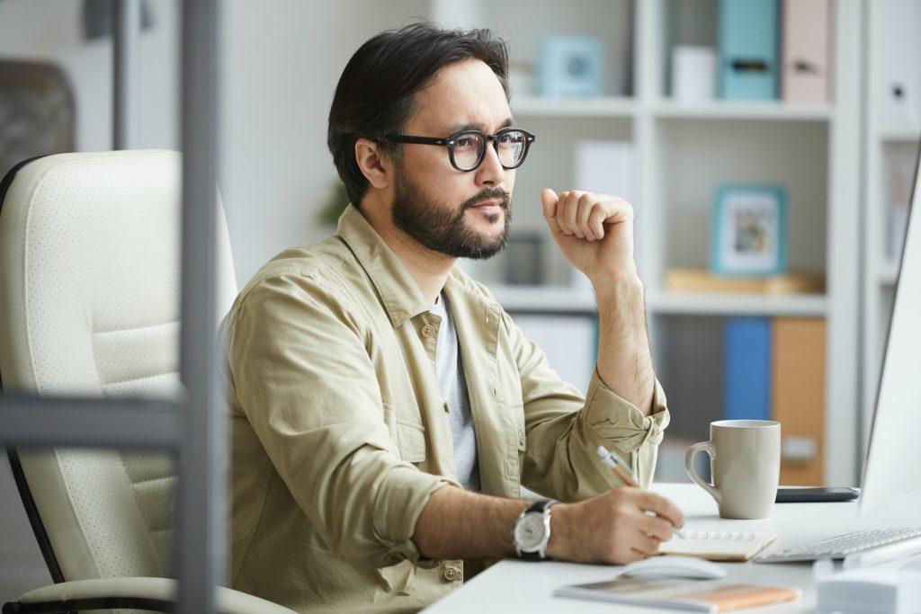 Asian manager analyzing ideas